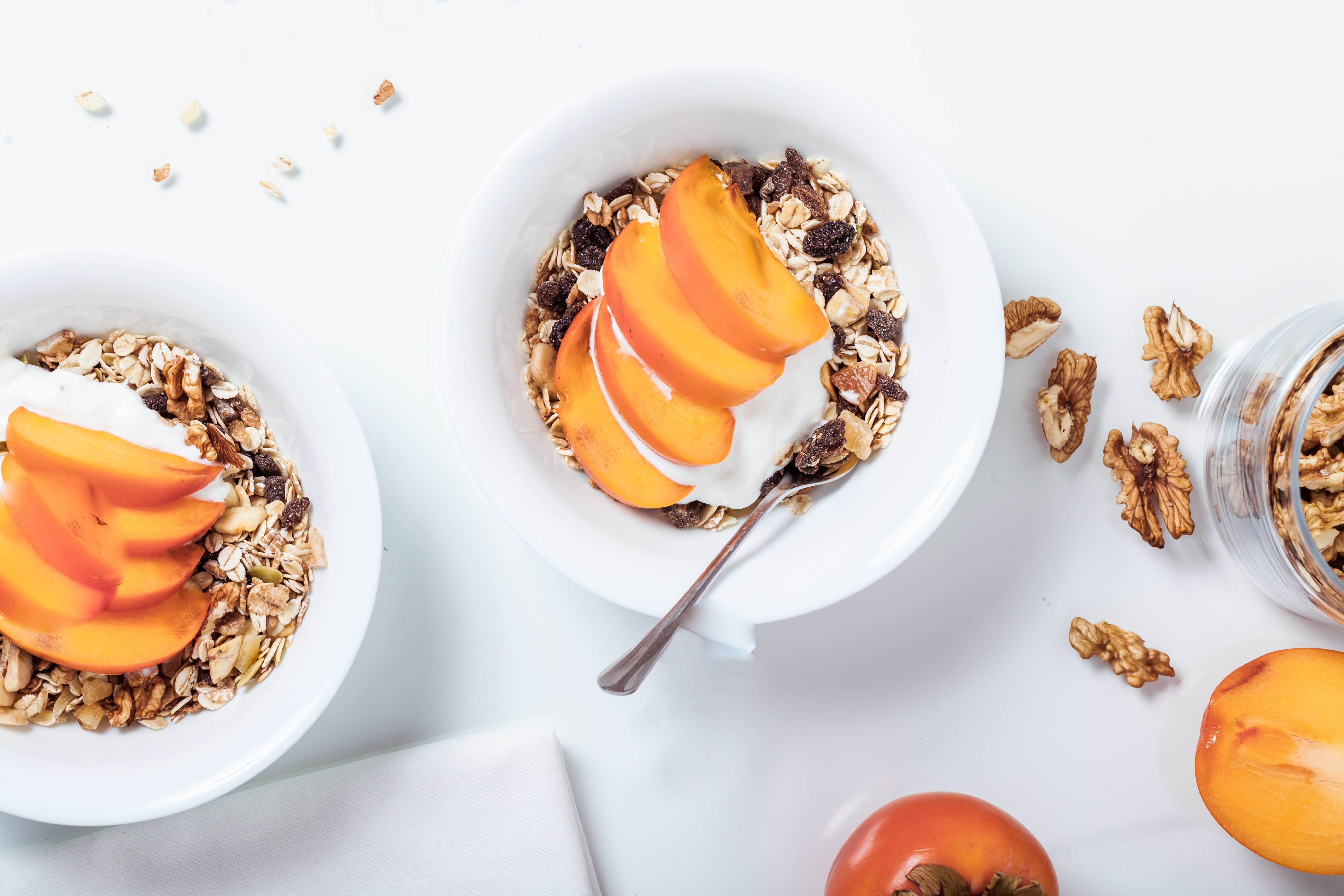 Two bowls with musli and fruit placed in a inspiring way